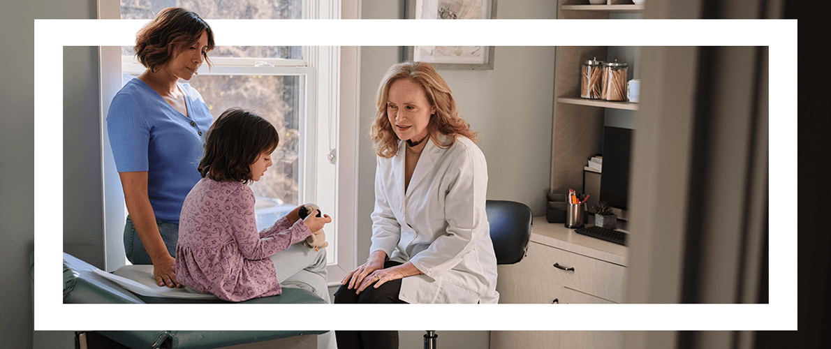 A mother and daughter with their doctor