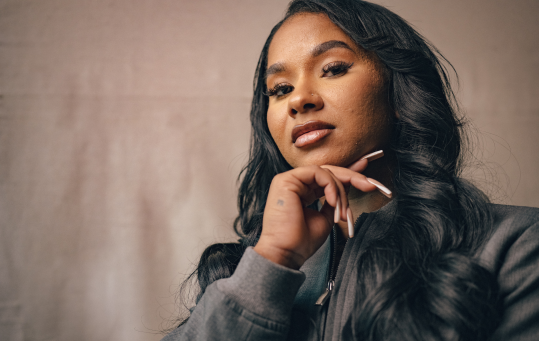 Jordan Chiles posing with her hand resting under her chin